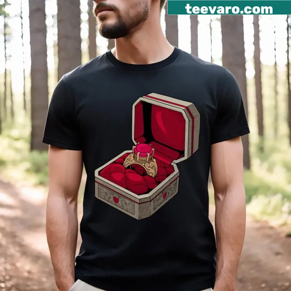 Ornate ring graphic on a royal-themed T-shirt.
