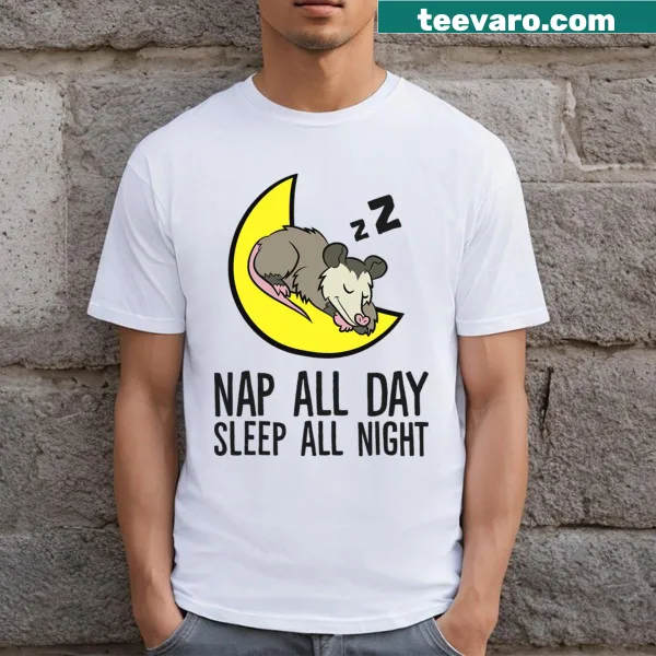 Cute T-shirt featuring a cartoon opossum sleeping