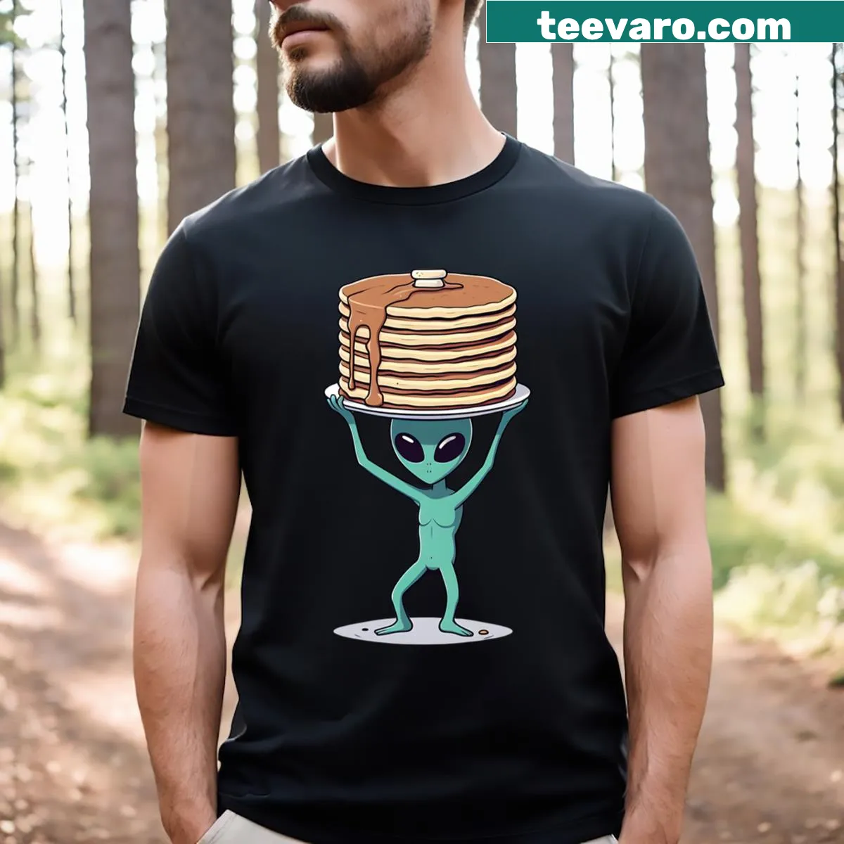 Cartoon alien balancing pancakes on T-shirt — on a men's t-shirt