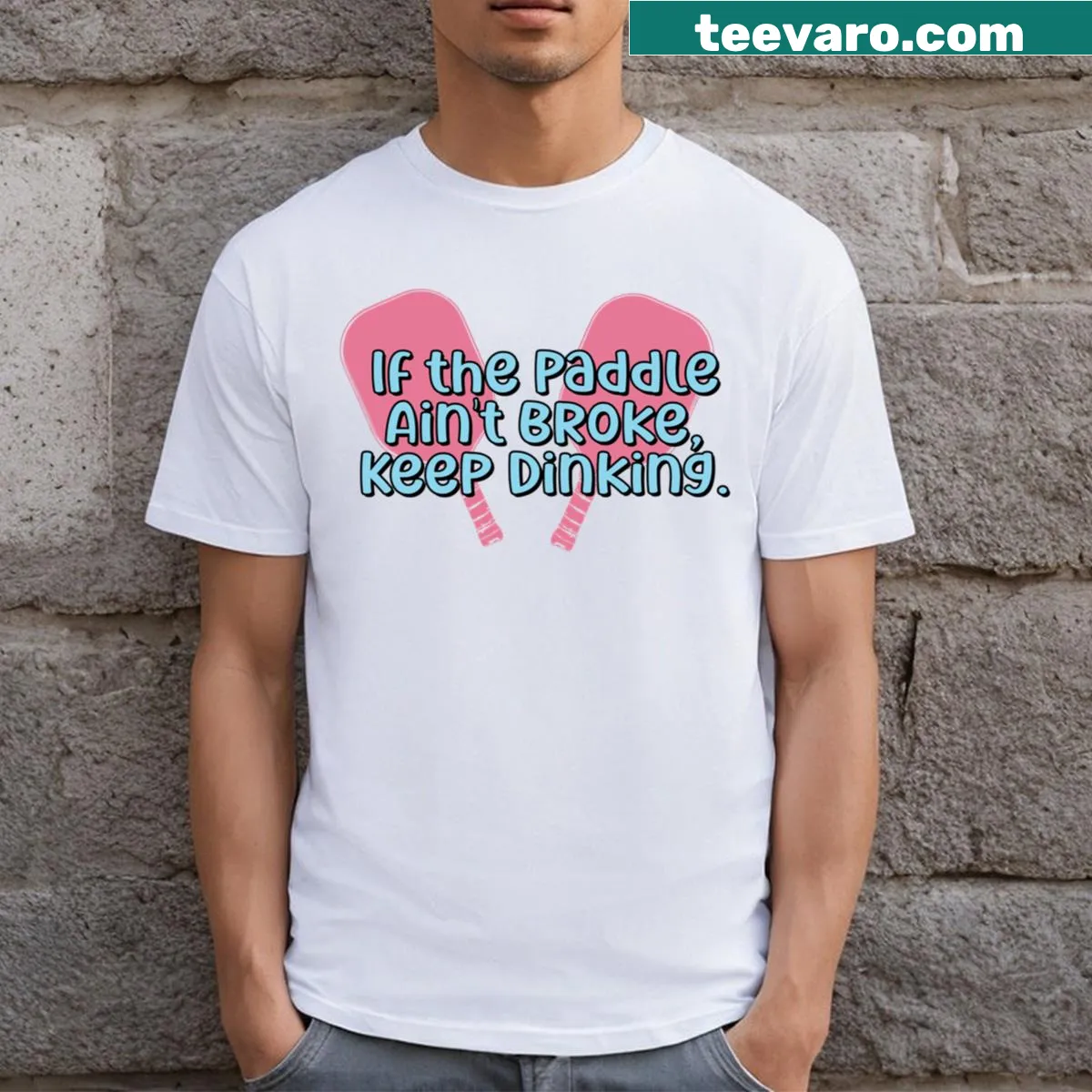 Funny pickleball shirt with the saying 'If The Paddle Ain't Broke Keep Dinking' — on a men's t-shirt