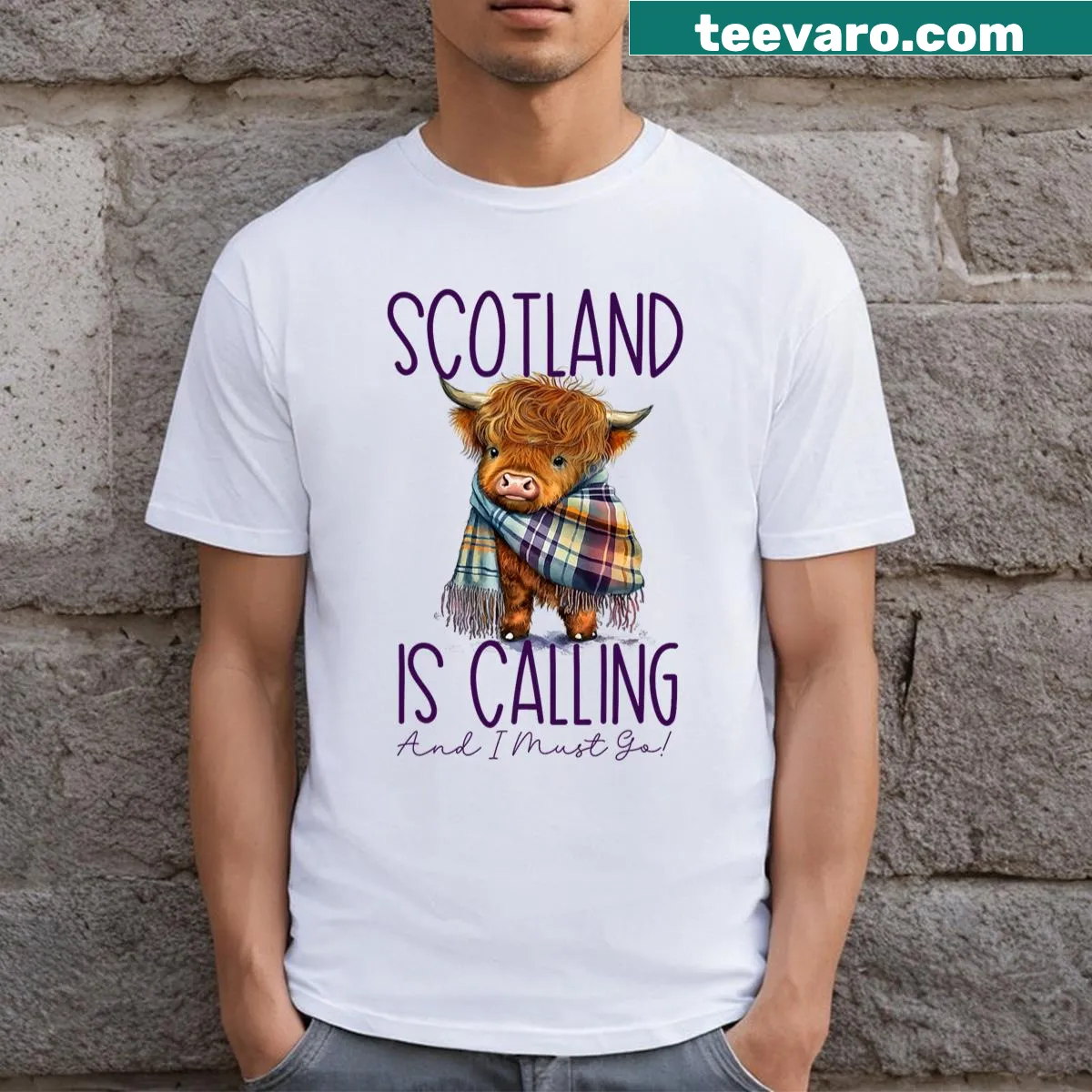 Illustration of a Highland cow with travel quote about Scotland — on a men's t-shirt