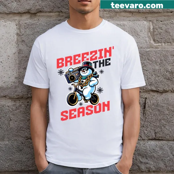 Cheerful snowman design with the phrase 'Breezin' The Season' on a T-shirt