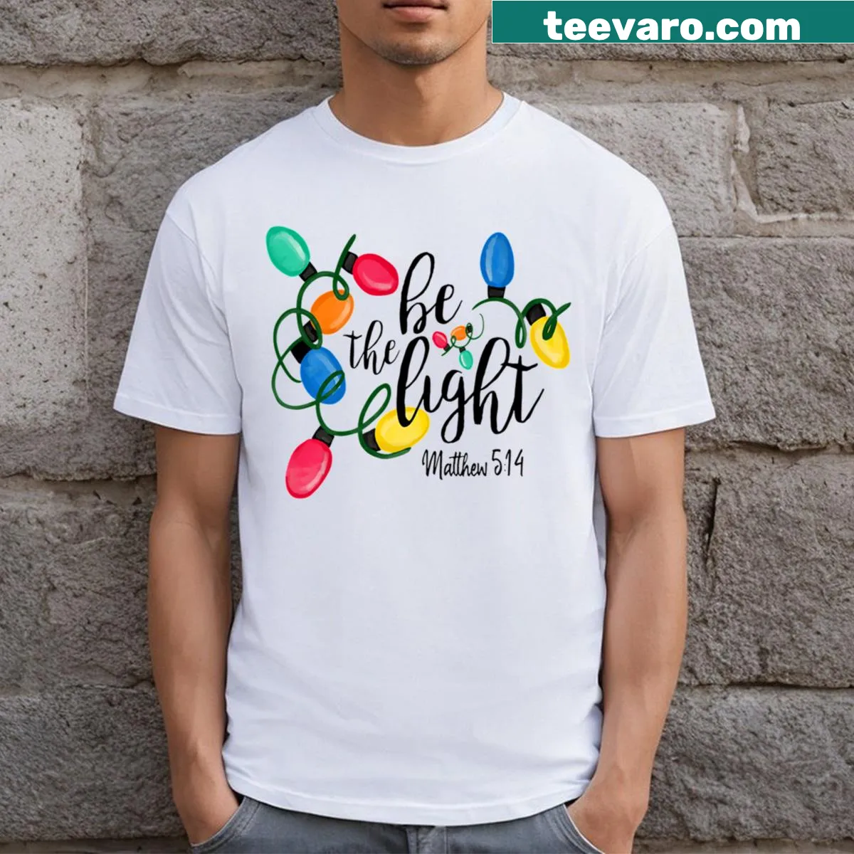 Inspirational 'Be The Light' Christmas tee with lights — on a men's t-shirt
