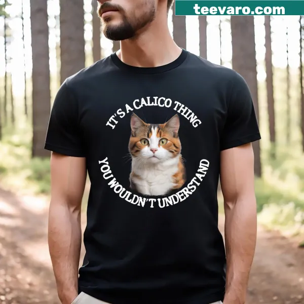 Graphic t-shirt with a cute calico cat and a quote about cats.