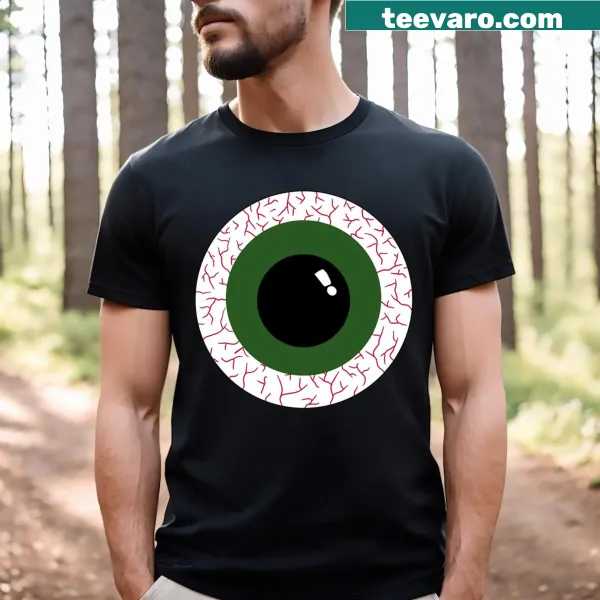 T-shirt featuring cartoonish green eyeballs with a playful design
