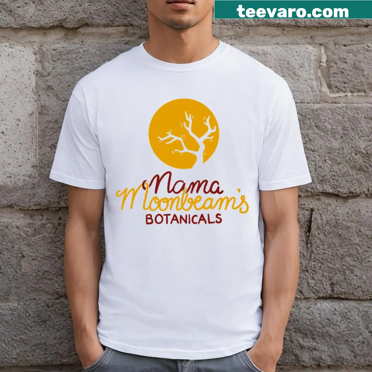 Mama Moonbeam's logo featuring botanicals in a detailed illustration — on a men's t-shirt