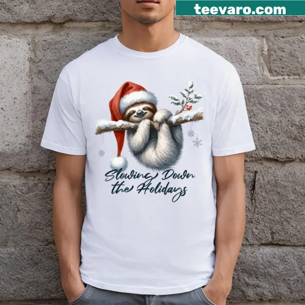 Cute sloth in a Santa hat on a winter-themed t-shirt.