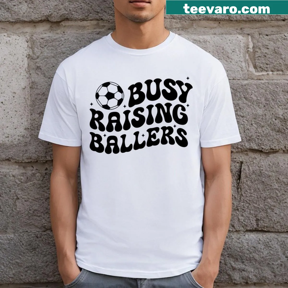 Funny T-shirt for soccer-loving dads with bold text about raising players — on a men's t-shirt