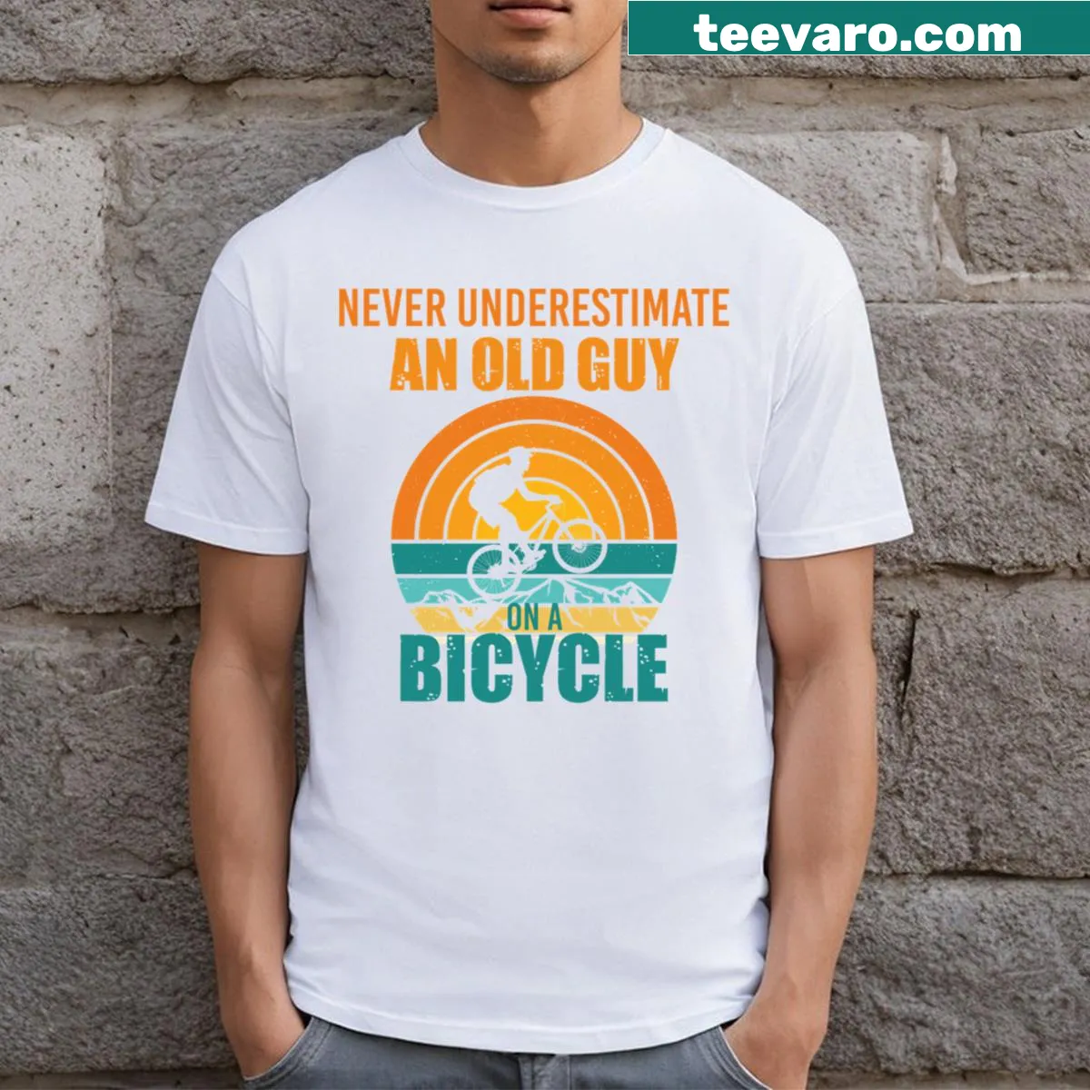 T-shirt with bold text saying 'Never Underestimate An Old Guy On A Bicycle' — on a men's t-shirt