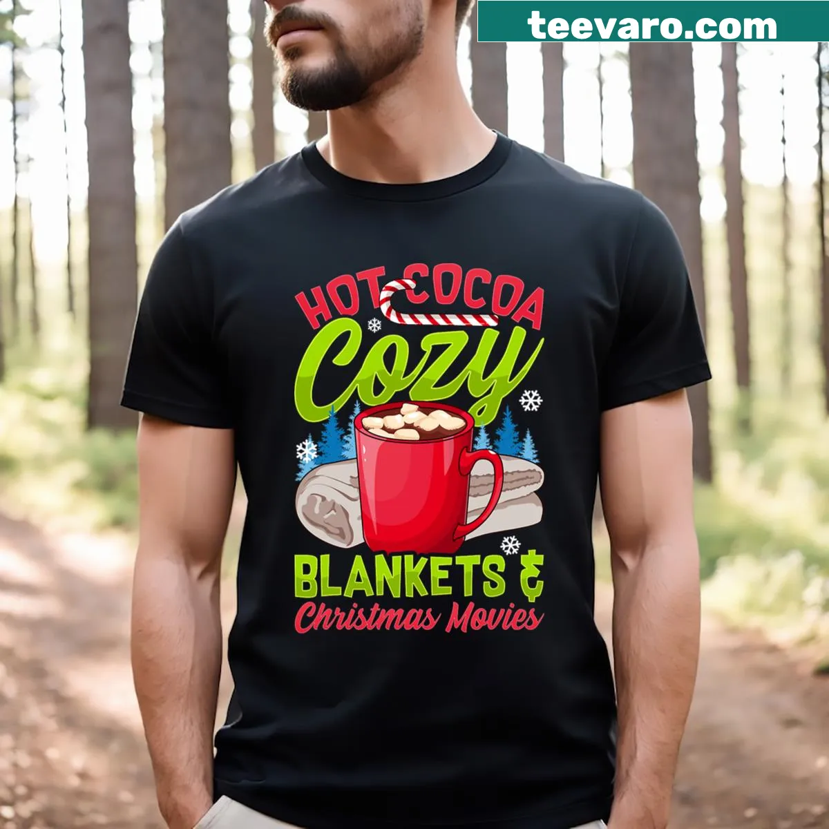 T-shirt featuring a warm holiday illustration with 'Hot Cocoa, Cozy Blankets & Christmas Movies.' — on a men's t-shirt