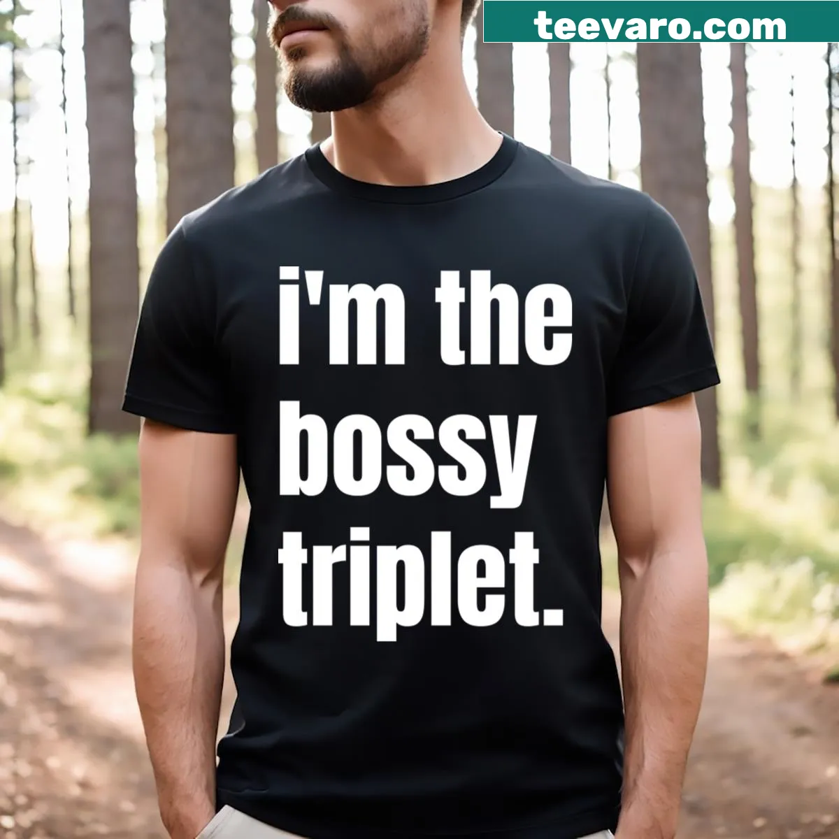 Humorous T-shirt for triplet moms declaring 'I'm The Bossy Triplet' — on a men's t-shirt