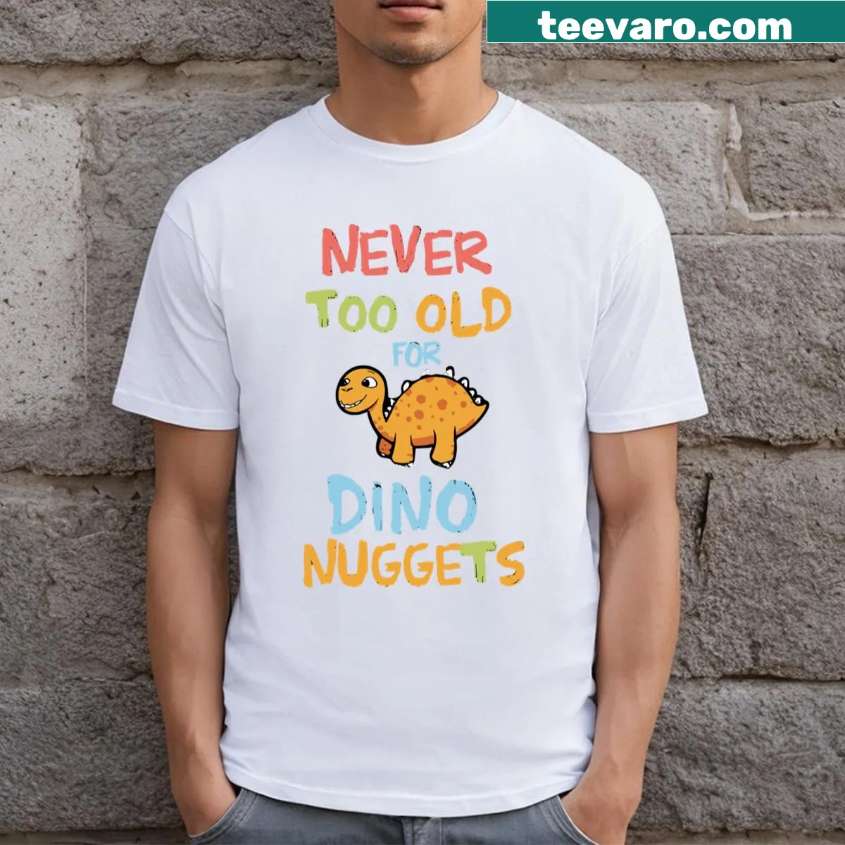 Playful T-shirt saying 'Never Too Old For Dino Nuggets' featuring fun typography — on a men's t-shirt