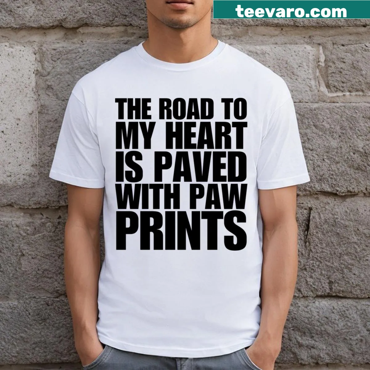 Funny dog T-shirt with the phrase 'The Road To My Heart Is Paved With Paw Prints' — on a men's t-shirt