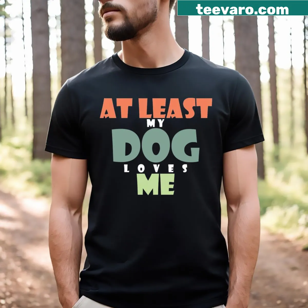 Playful t-shirt with the phrase At Least My Dog Loves Me — on a men's t-shirt