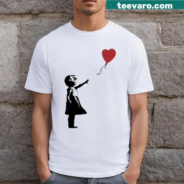 Banksy-inspired girl reaching for balloon graphic on T-shirt