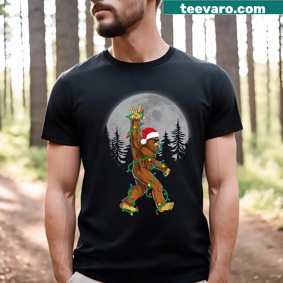 Funny t-shirt of Bigfoot dressed as Santa with Christmas lights — on a men's t-shirt