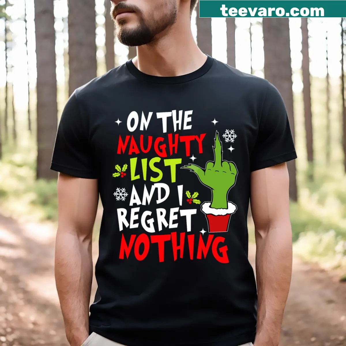 Funny Christmas T-shirt featuring the text 'On The List Of Naughty And I Regret Nothing' — on a men's t-shirt