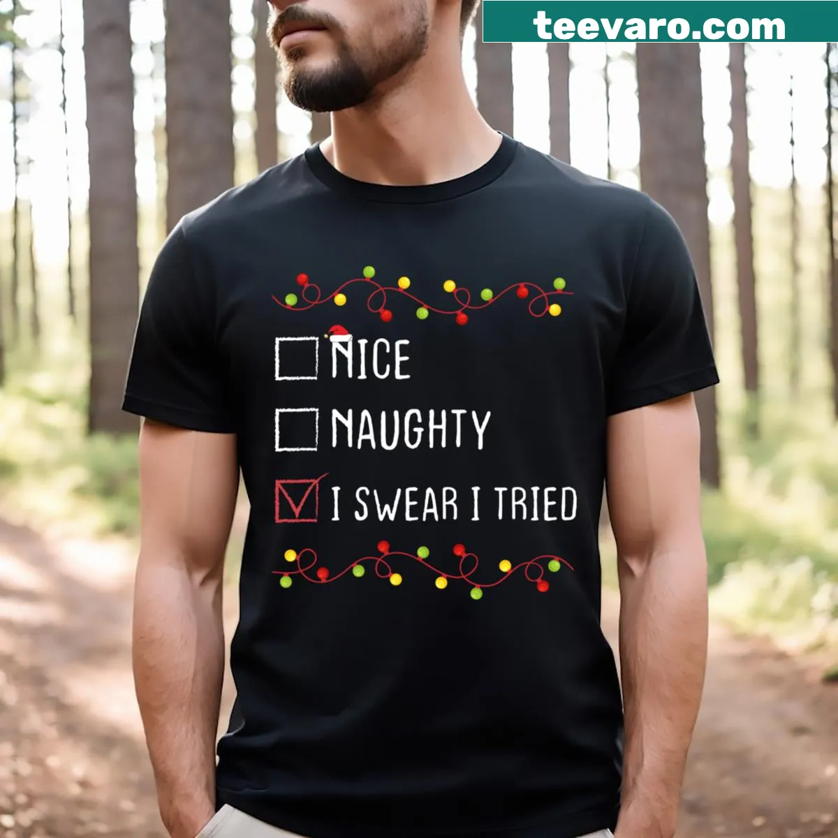 Humorous Christmas T-shirt with 'Nice Naughty I Swear I Tried' — on a men's t-shirt