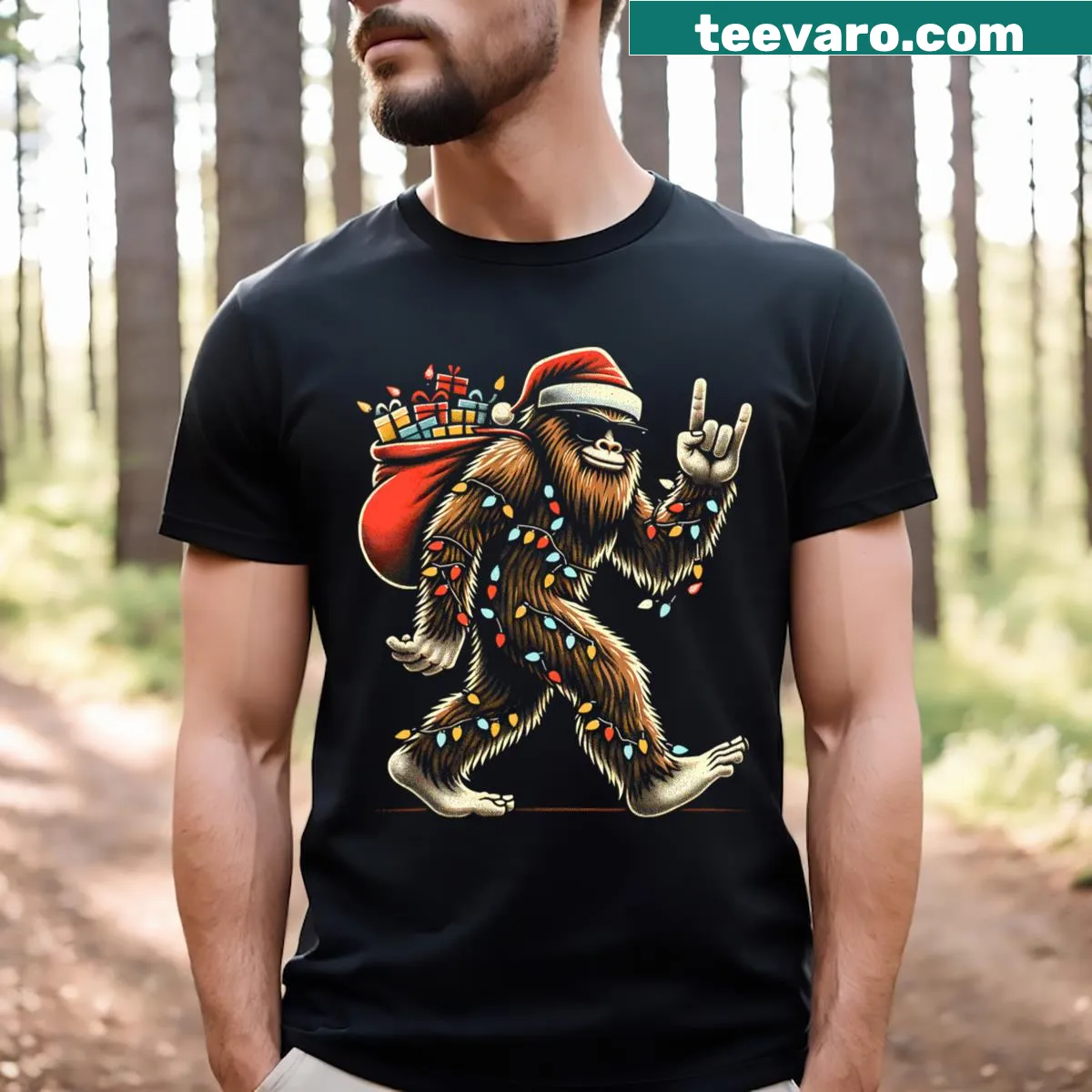 Funny Sasquatch t-shirt with Christmas lights and Believe text — on a men's t-shirt