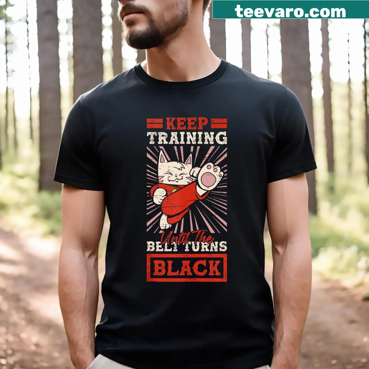 T-shirt featuring a karate black belt and a playful cat illustration — on a men's t-shirt