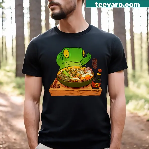Playful t-shirt depicting a frog making ramen art