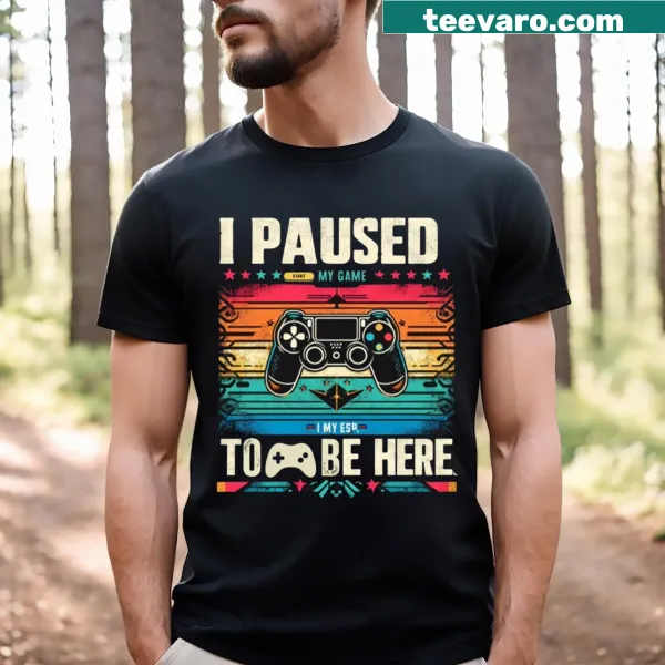 T-shirt with the phrase 'I Paused My Game To Be Here 1' in a playful design