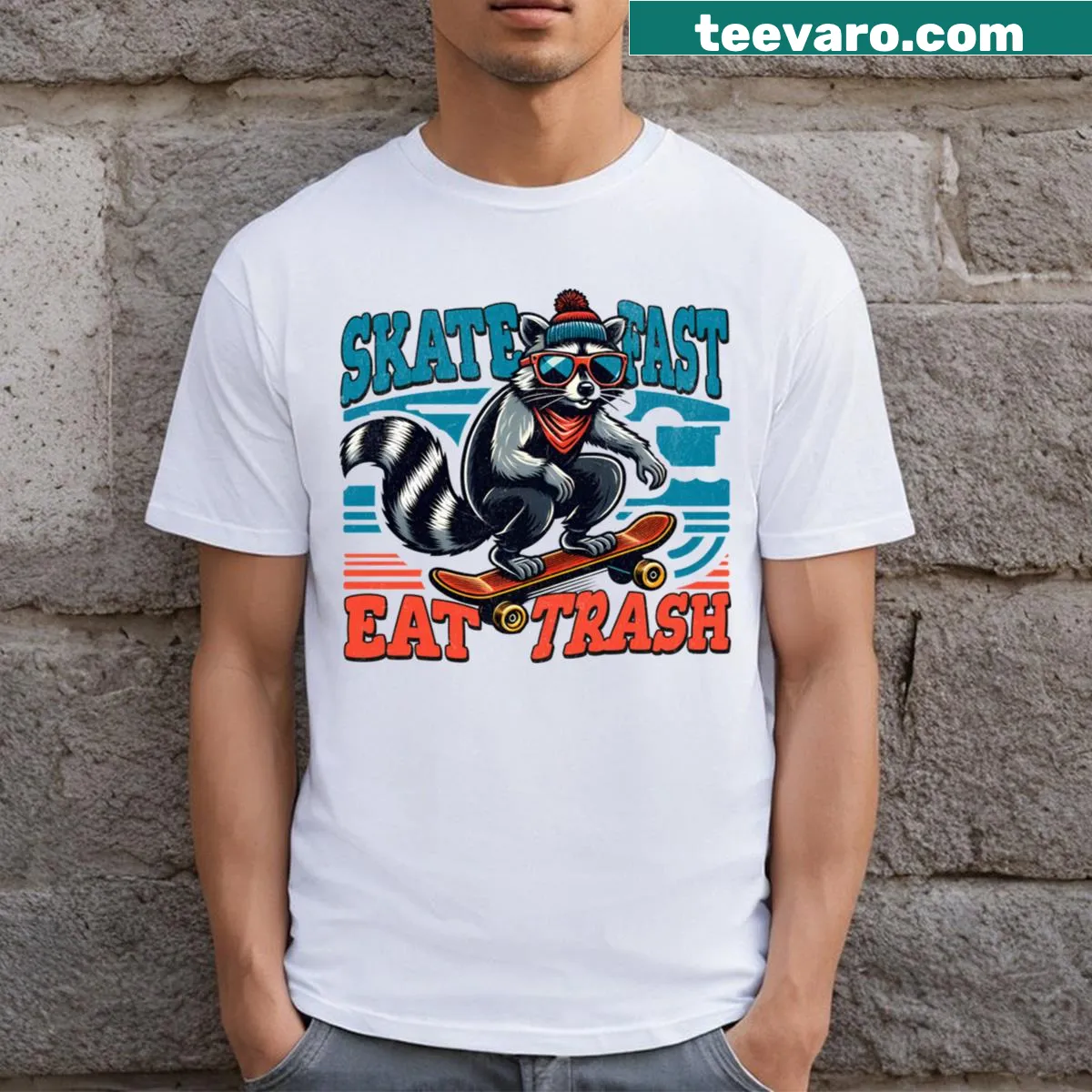 Illustration of a raccoon skating with the phrase 'Skate Fast Eat Trash' — on a men's t-shirt