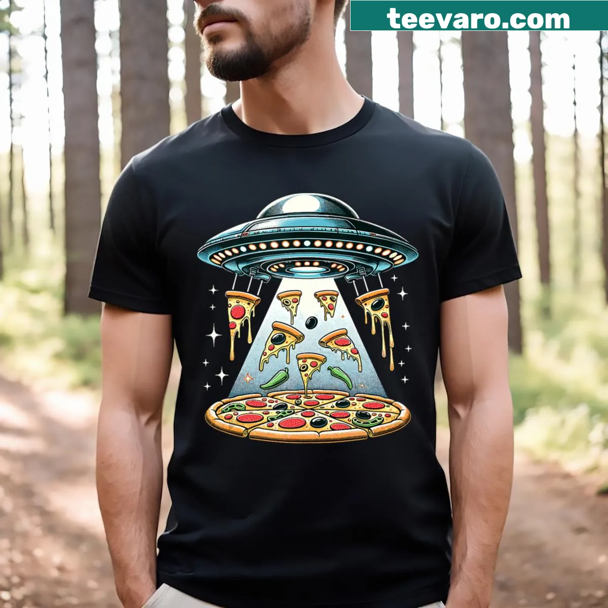 Humorous T-shirt with UFO and alien cartoon eating pizza — on a men's t-shirt