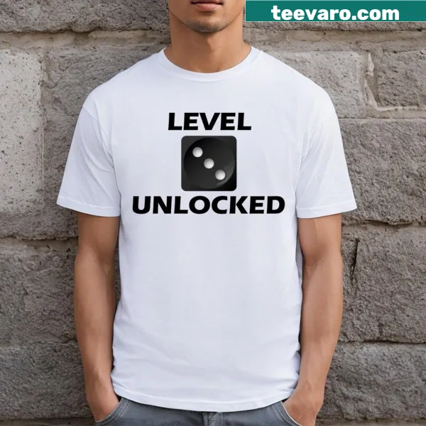 T-shirt featuring bold text: Roll The Dice And Unlock New Levels.