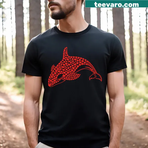 Killer whales forming a heart against the ocean backdrop on a t-shirt