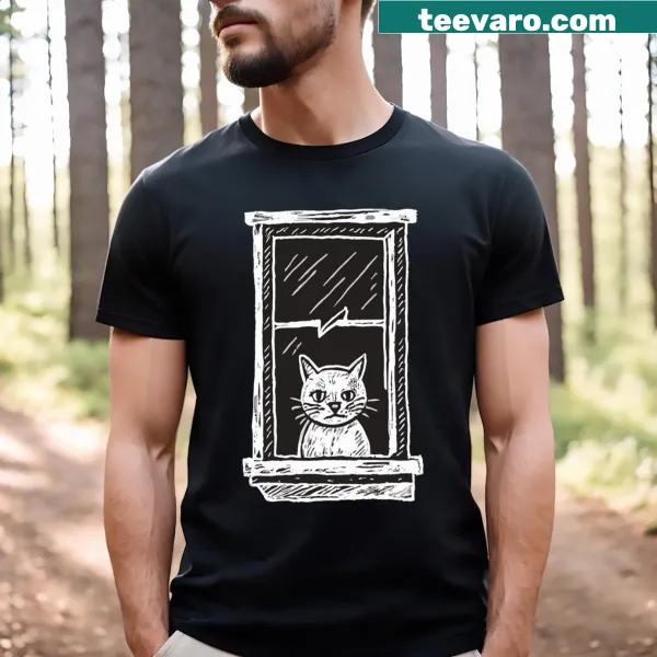 T-shirt featuring a cat peacefully sitting in a window