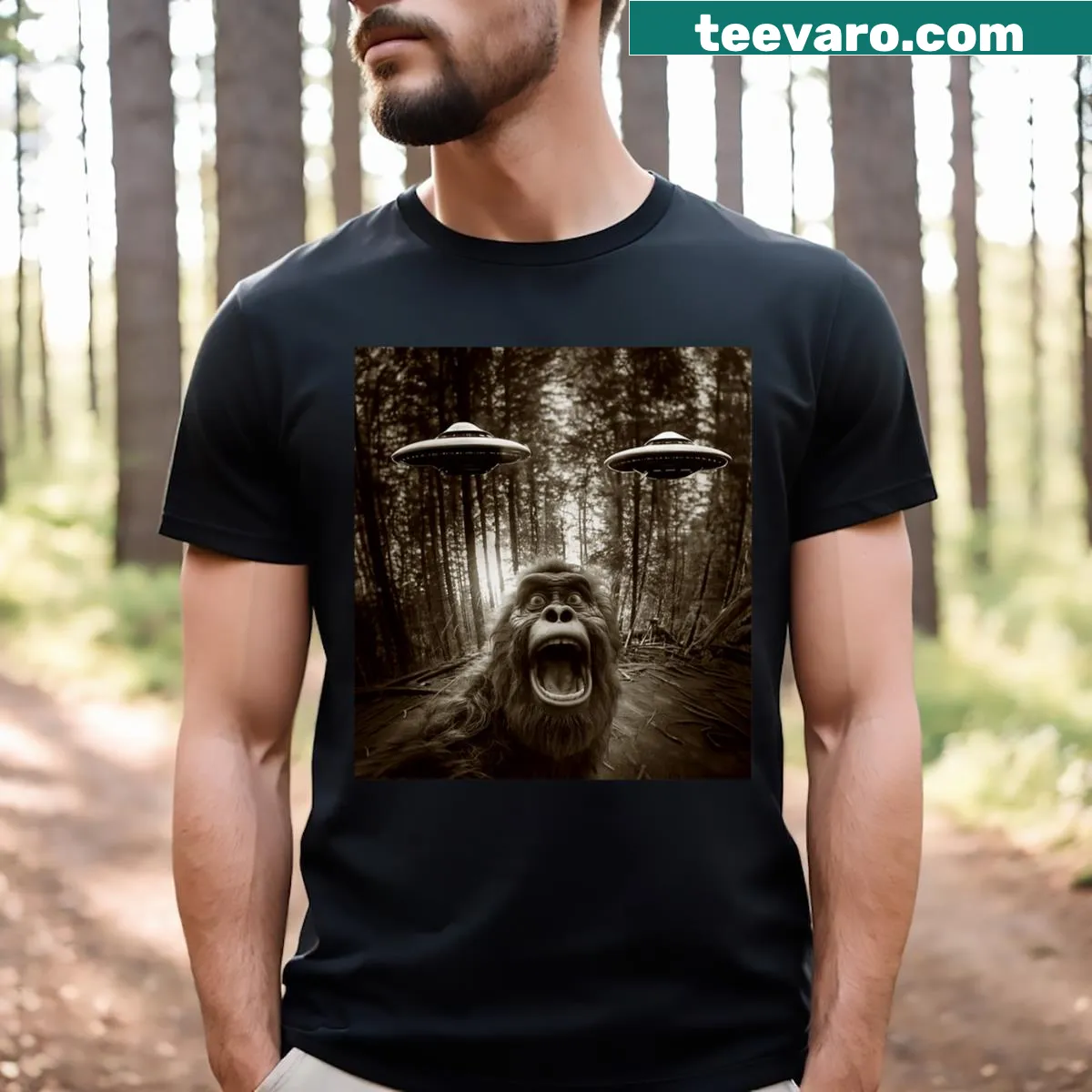 Cartoon graphic of Bigfoot, alien, and UFO on T-shirt — on a men's t-shirt