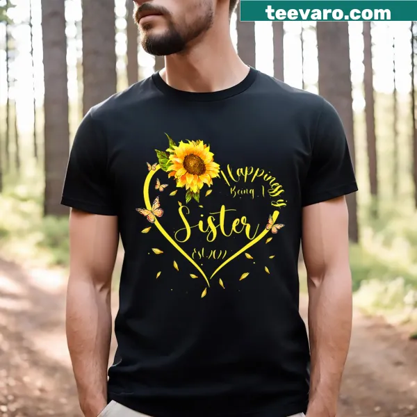 T-shirt with sunflowers and a message celebrating sisterhood.