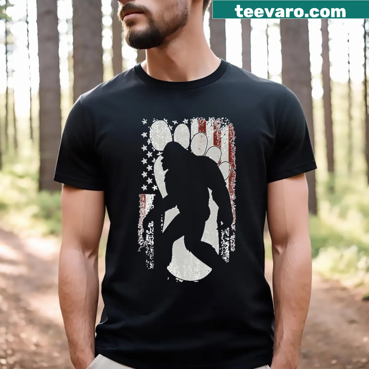 T-shirt featuring Bigfoot with an American flag illustration — on a men's t-shirt