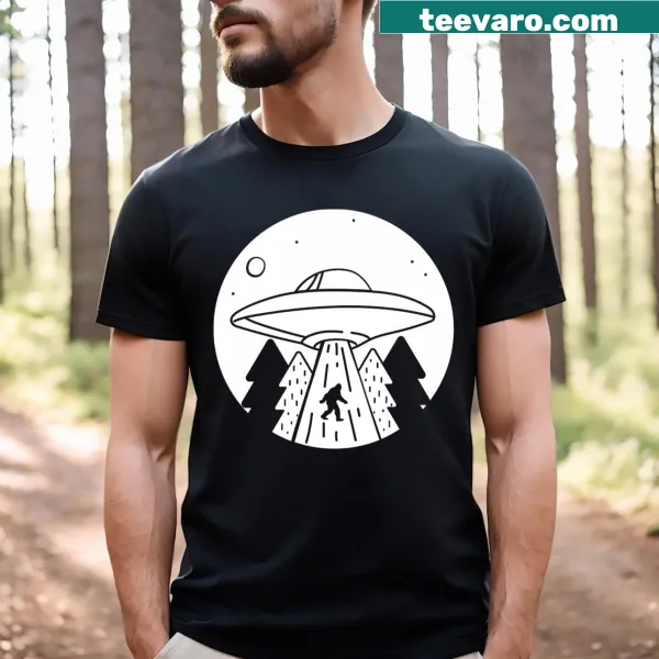 Whimsical UFO and Bigfoot abduction graphic on T-shirt