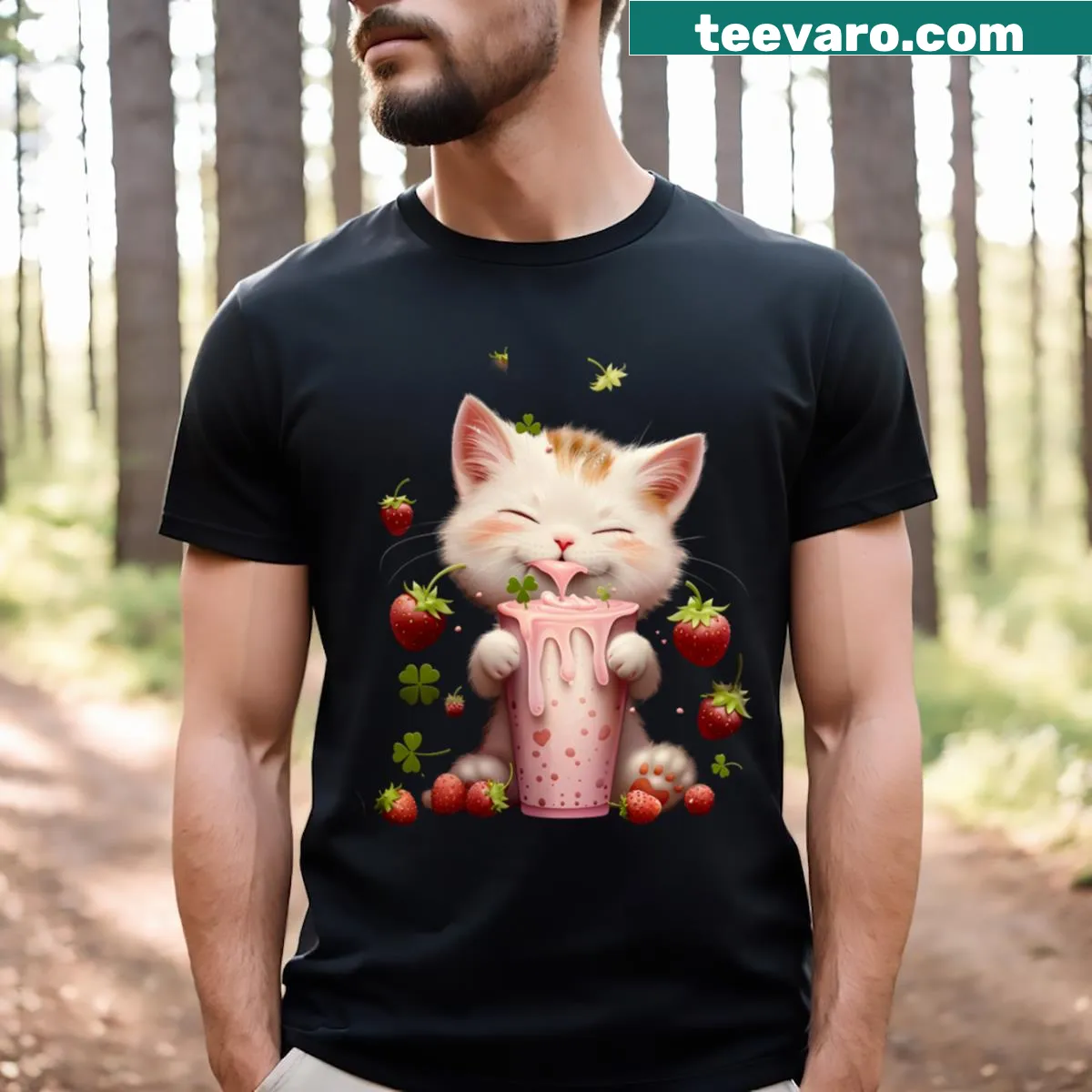 Whimsical T-shirt featuring illustrations of cats and strawberries. — on a men's t-shirt