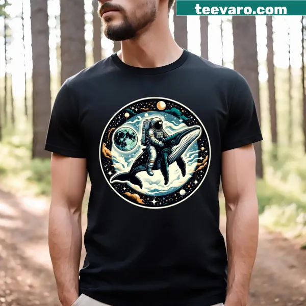T-shirt featuring an astronaut riding a whale in outer space