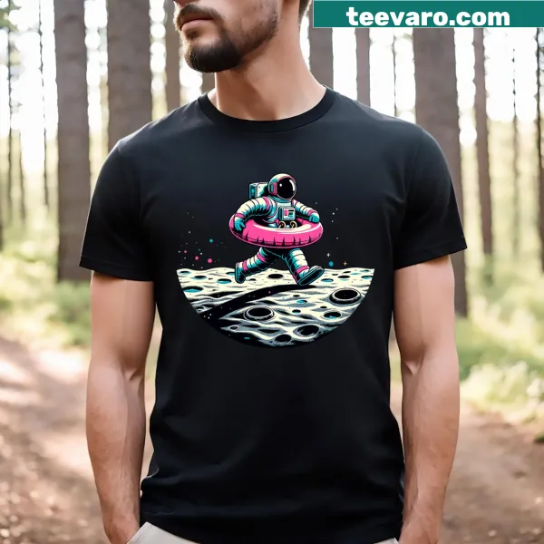 Funny T-shirt featuring an astronaut on a pink float in space