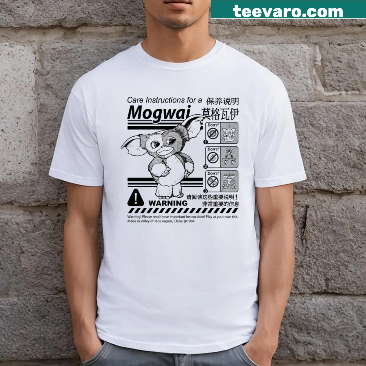 Gizmo warning label graphic on a T-shirt — on a men's t-shirt