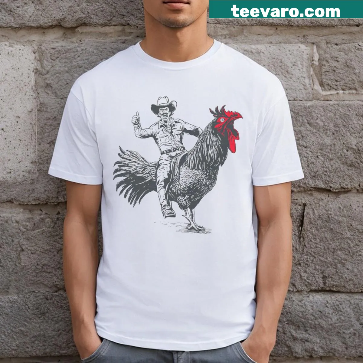 Whimsical cowboy riding a chicken graphic on T-shirt — on a men's t-shirt
