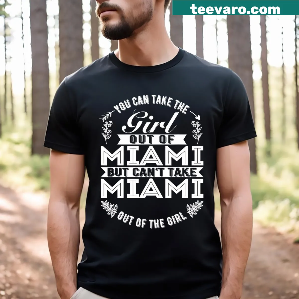 T-shirt featuring the phrase 'You Can Take The Girl Out Of Miami' in a stylish typography — on a men's t-shirt