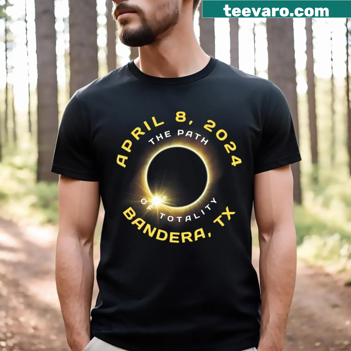 Badge-style commemorative t-shirt for the April 2024 solar eclipse in Bandera, Texas — on a men's t-shirt