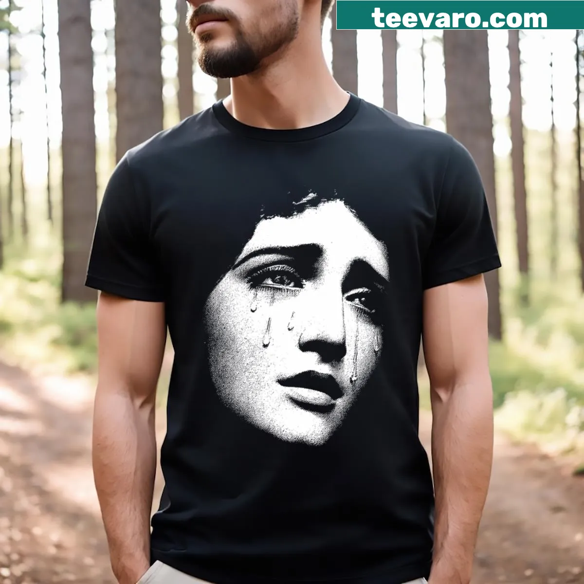 Blessed In Tears t-shirt with a face graphic and text — on a men's t-shirt