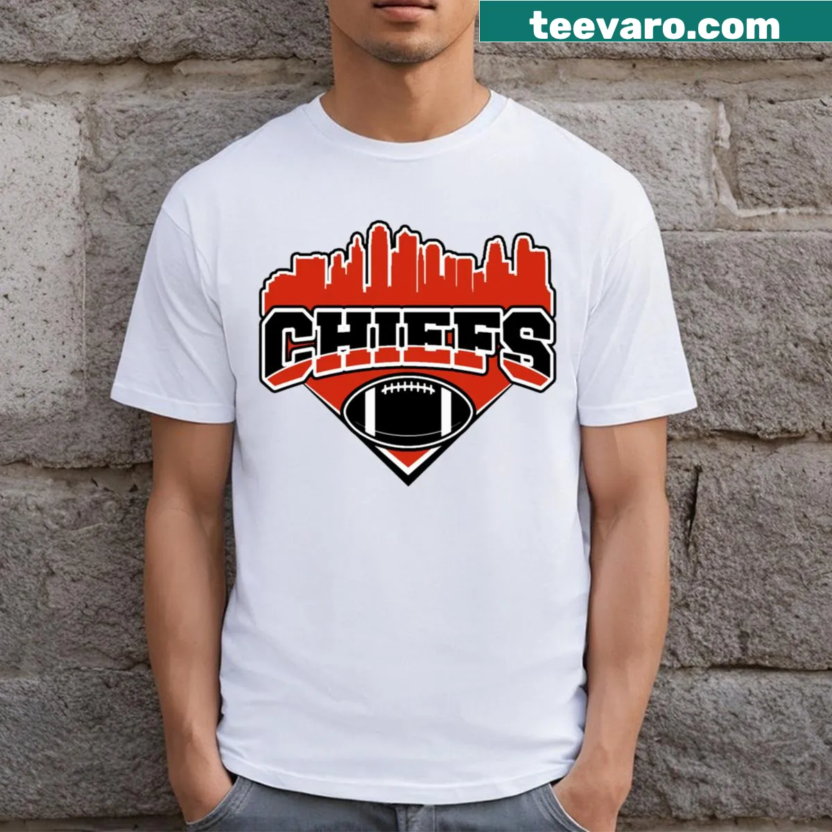 Illustrated skyline design featuring Chiefs Football logo and landmarks. — on a men's t-shirt