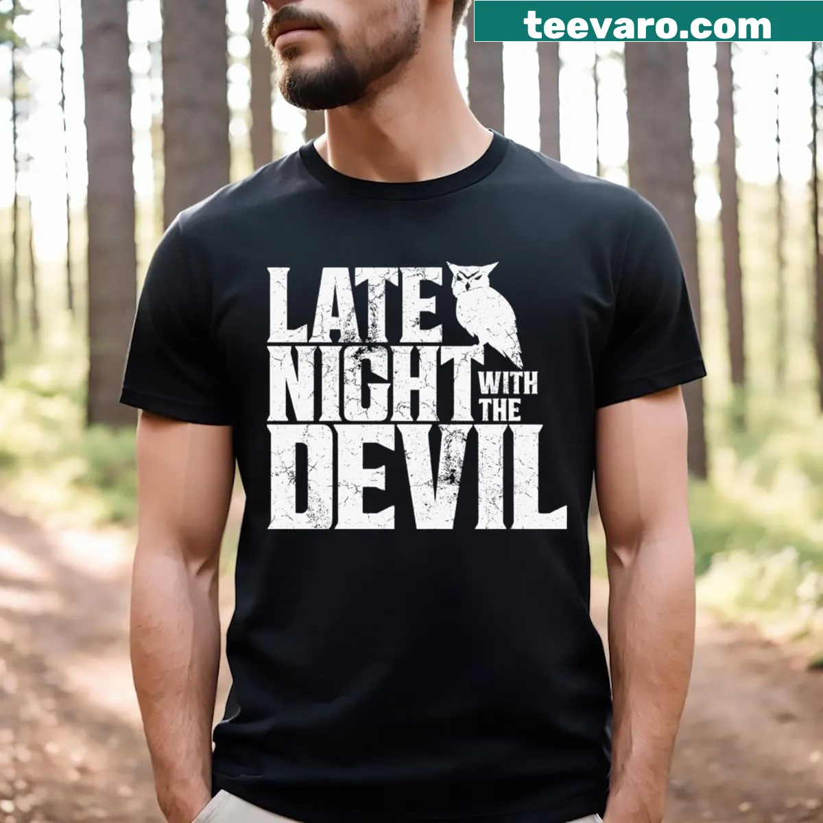 T-shirt with bold text 'Late Night With The Devil' in a spooky style — on a men's t-shirt