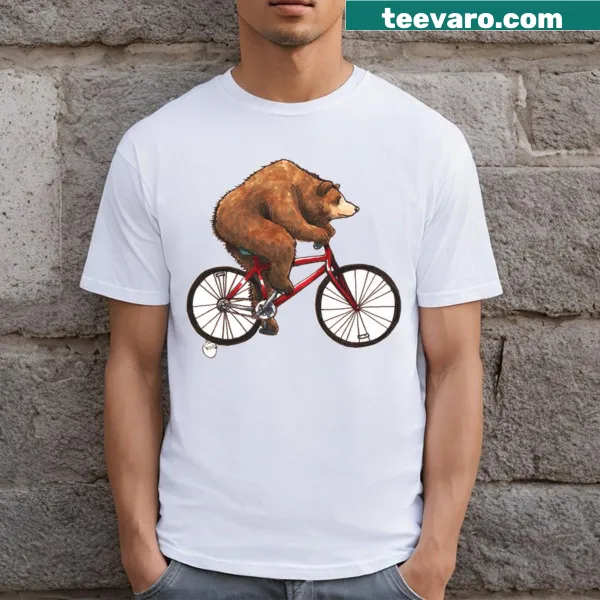 T-shirt featuring a bear riding a bike in a fun design