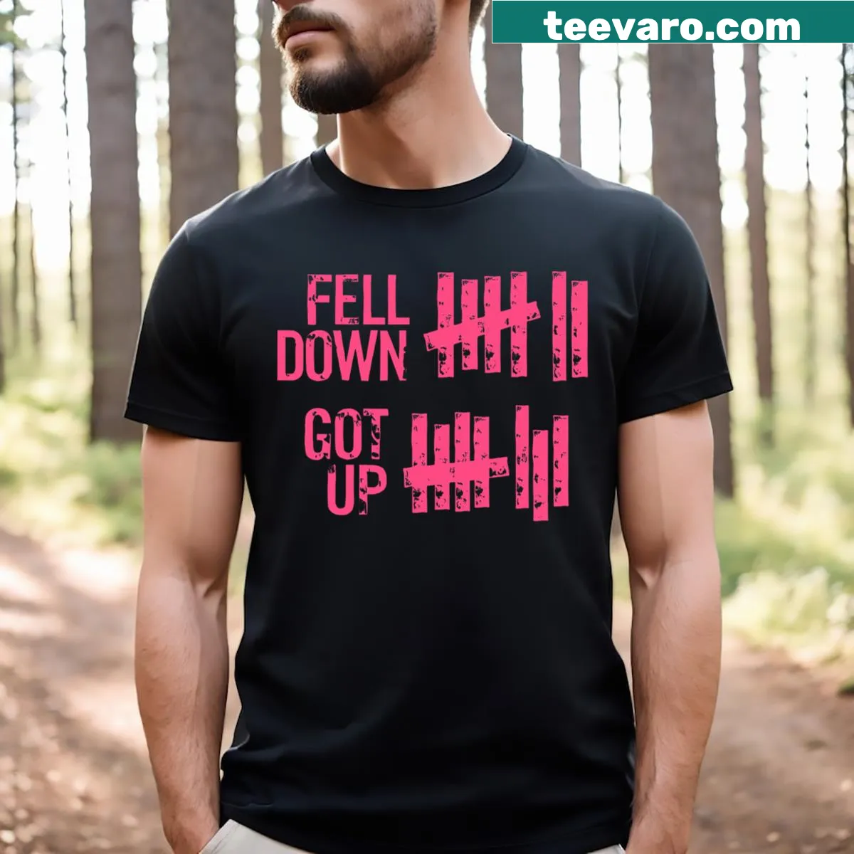 Motivational shirt with the phrase 'Fell Down Got Up' in bold typography — on a men's t-shirt