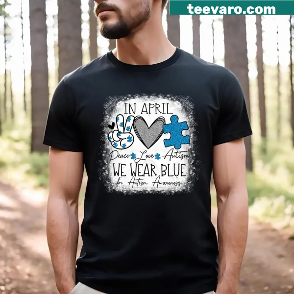 T-shirt with text promoting Autism Awareness featuring peace and love symbols.
