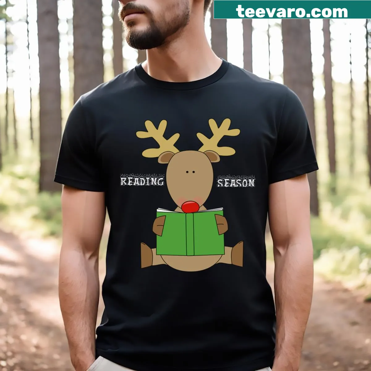 A cheerful reindeer with a mug ready for Christmas reading. — on a men's t-shirt