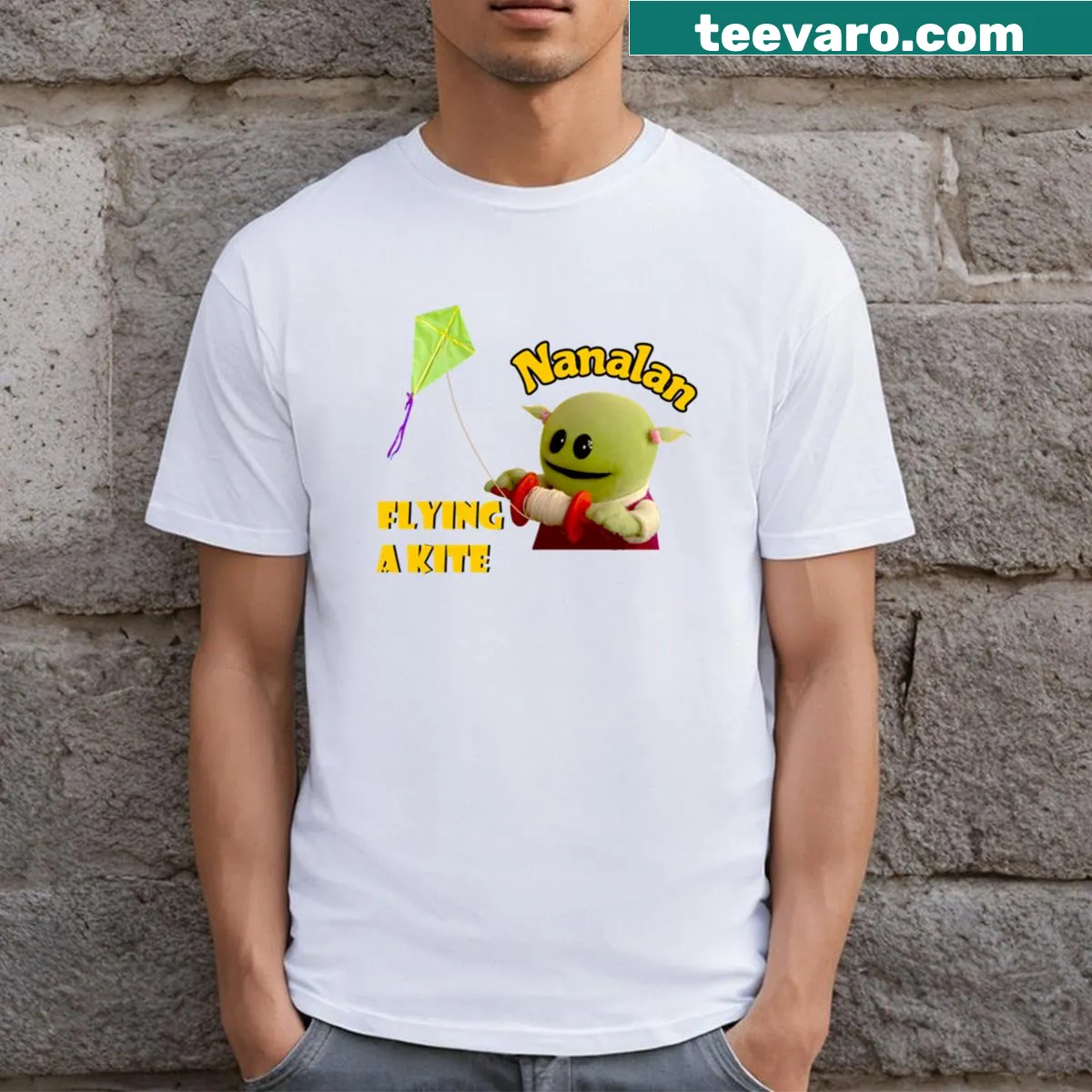 Kids' T-shirt featuring Nanalan character Mona kite-flying — on a men's t-shirt